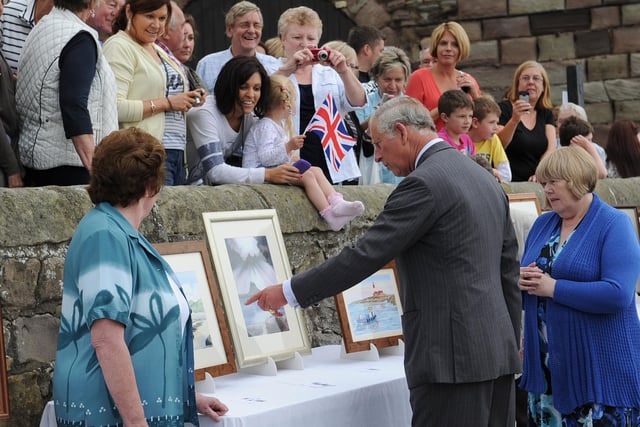 HRH Prince Charles meets local artists during a visit to Seahouses.