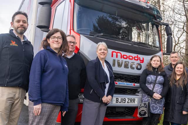 From left, Mike Denbury, Catherine Kirkham, Richard Moody, and managing director Caroline Moody with Peter’s daughter Jessica Marszalkowski, family friend Brian Jones, and niece Emily Leightley alongside the truck named Geordie Squirrel in Peter’s memory. (Photo by Moody Logistics)