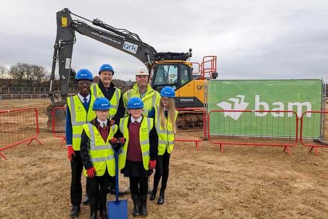 Executive headteacher John Barnes, Cllr Guy Renner-Thompson, and students from Astley Community High School and Whytrig Middle School at the new school site. (Photo by Northumberland County Council)
