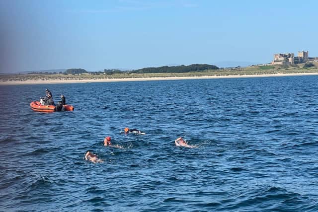 The swimmers had safety support throughout.