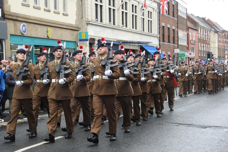 The parade marches through Morpeth town centre.