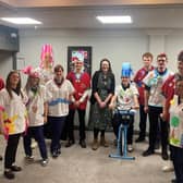Rebecca Fish, apprenticeship services manager, with Northumbria Healthcare apprentices in scrubs representing the charities they will support. (Photo by Northumbria Healthcare)