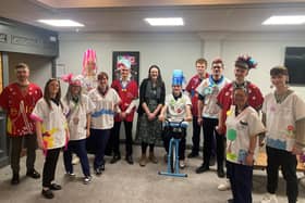 Rebecca Fish, apprenticeship services manager, with Northumbria Healthcare apprentices in scrubs representing the charities they will support. (Photo by Northumbria Healthcare)
