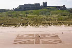 The Union Jack sand art created for VE Day at Bamburgh Castle. Picture by Owen Humphreys.