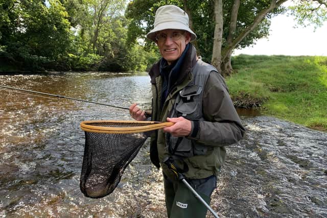A complete beginner on one of angling instructor Bob Smith's introductory courses on river fishing catches a brown trout on the River Coquet. Picture by Bob Smith