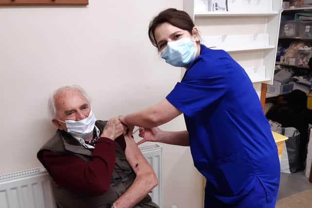 Dr James Mitchell, the first person to get a Covid-19 vaccine at Well Close in Berwick, with lead practice nurse Mandy Thompson.