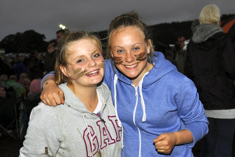 Lily Robson and Lauren Carter in the muddy Pastures at the Jessie J concert.