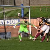 Jordan Sinclair is bundled over in the box in the game against Linlithgow Rose. Picture: Ian Runciman.