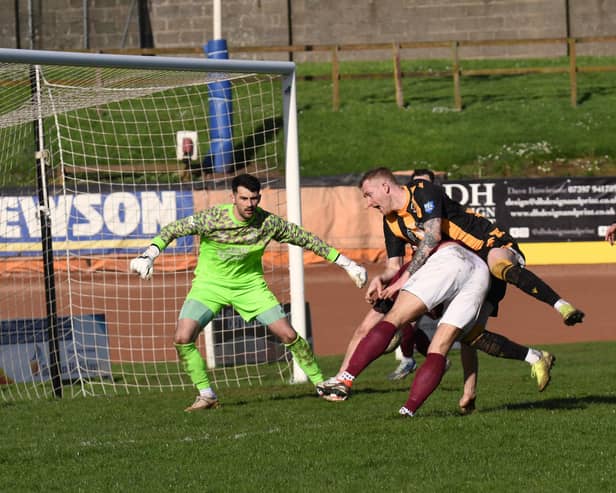 Jordan Sinclair is bundled over in the box in the game against Linlithgow Rose. Picture: Ian Runciman.