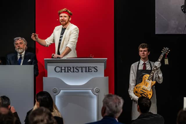 The final guitar is auctioned, raising £403,200 for Teenage Cancer Trust. (Photo by Guy Bell/Christie's Images)