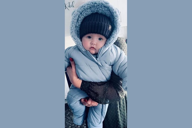 Casey, age 5 months, is ready for whatever the Christmas weather forecast brings.