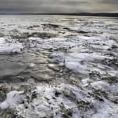 Ice by the causeway to Holy Island. File image.
