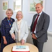 Volunteer Betty Scott cutting Wansbeck General Hospital's 30th birthday cake, after volunteering at the hospital since it opened.