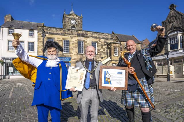 Exchanging letters of friendship are Alnwick Town Crier, Roger Daniel, the Mayor of Alnwick, Geoff Watson and South Lanarkshire Town Crier, Phylip de la Mazlere. Picture: Jane Coltman