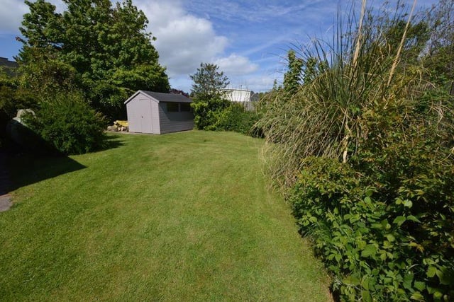 The gardens are located to the side and rear of the property and are mostly laid to lawn.