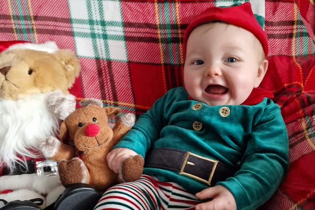 Tobias, age 8 months, ready to celebrate his first Christmas.