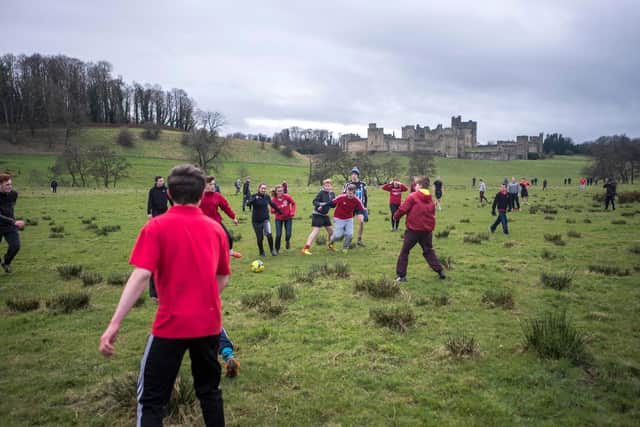 The game is played in the town’s Pastures, in the shadow of Alnwick Castle. Picture by Michael Pearson.