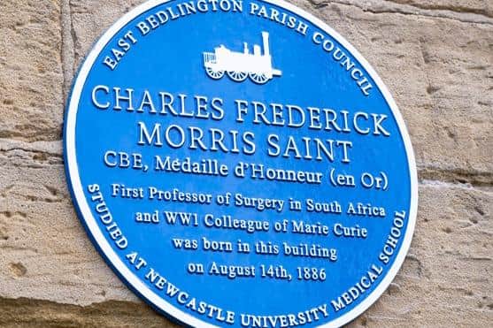 The Blue Plaque on Bedlington Station Library honouring Charles Saint.