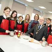 Mayor Geoff Watson with DCHS head of food Louise Milburn and lunch club students. Picture: Alnwick Town Council