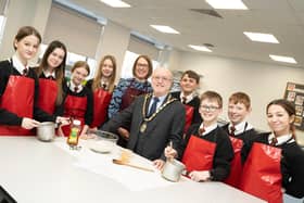 Mayor Geoff Watson with DCHS head of food Louise Milburn and lunch club students. Picture: Alnwick Town Council