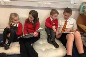 Older pupils read to younger ones.