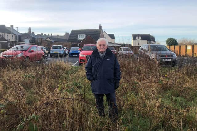 Cllr Jeff Watson at the site of the new Amble car park.