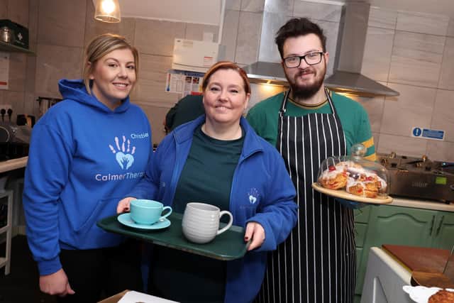 Christie Blackburn and Donna Swan from Calmer Therapy, with Craig from the Calmer Café on its opening day. (Photo by Helen Smith)