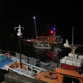 A photo shared by Amble's RNLI team showing its lifeboat returning with the yacht after the crew reported it was taking on water 4 miles east of Alnmouth.