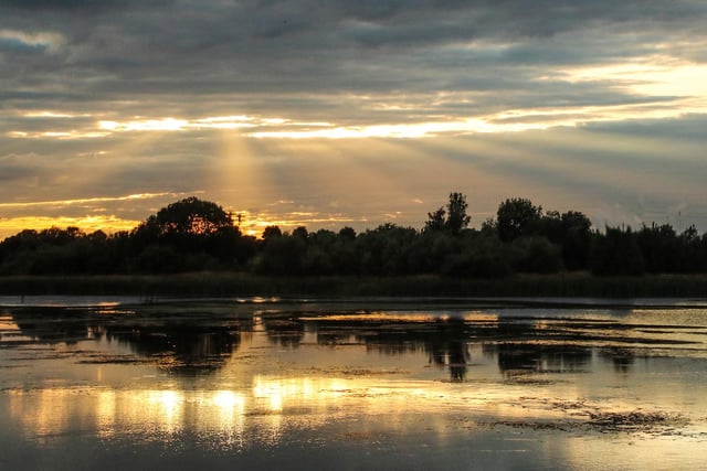 Sunbeams burst through the clouds to shine light on just one of many of Northumberland's majestic lakes.
