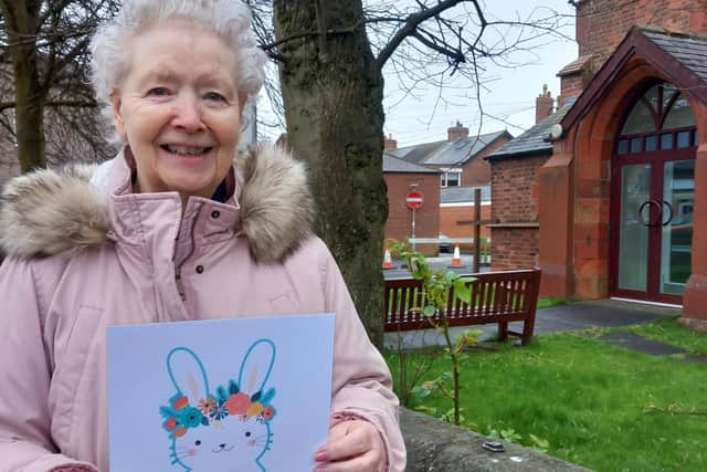 A care home resident with one of the numbered bunnies from the hunt.