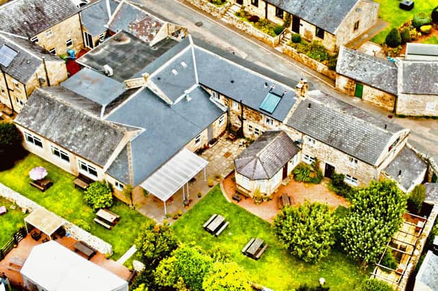 An aerial view of The Rose and Thistle, Alwinton.