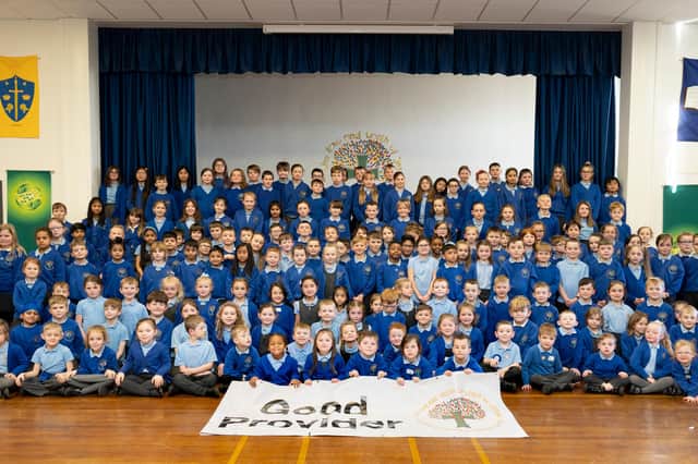 Pupils at St Aidan’s RC Primary School, Ashington, celebrate a 'Good' rating by Ofsted.