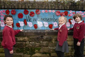 Pupils from St Robert's Catholic First School next to a section of the display. Picture by Kate Buckingham.