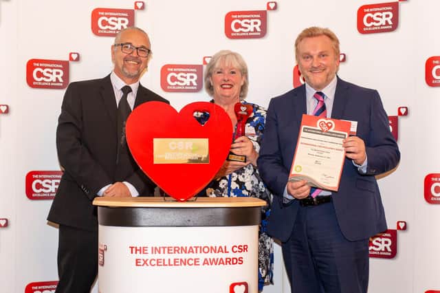 Brenda Longstaff, head of Northumbria Bright Charity (centre), and Wayne Daley, Head of CSR at Northumbria Healthcare (right), receiving the award.