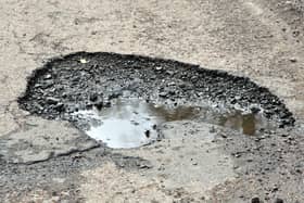 Potholes on the road that runs from the East Thornton junction to the main road into Netherwitton.