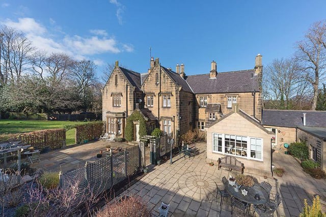 Attractive stone terraces leading from the garden room are ideal for outside entertaining and barbecues.