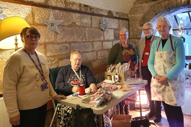Manager Stella McLaren and some of the volunteers at the 'Christmas Presence' in Berwick. Picture by Margaret Shaw.