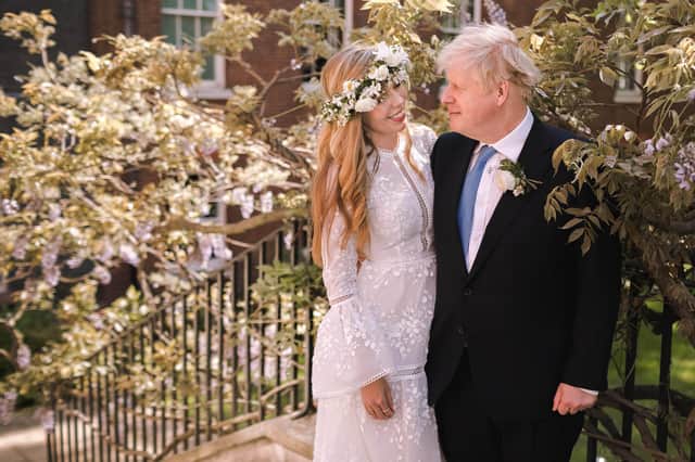 Prime Minister Boris Johnson with his wife Carrie Johnson following their wedding at Westminster Cathedral in May 2021. Photo by Rebecca Fulton / Downing Street via Getty Images.