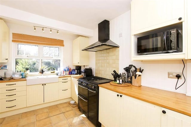 The modern-fitted kitchen to the front of the property has been tastefully finished with wall and base units.
