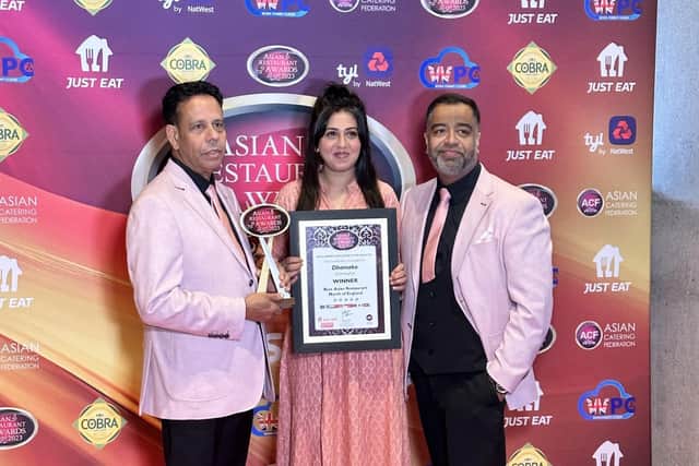 The Dhamaka team collecting the award. (Photo by Dhamaka)