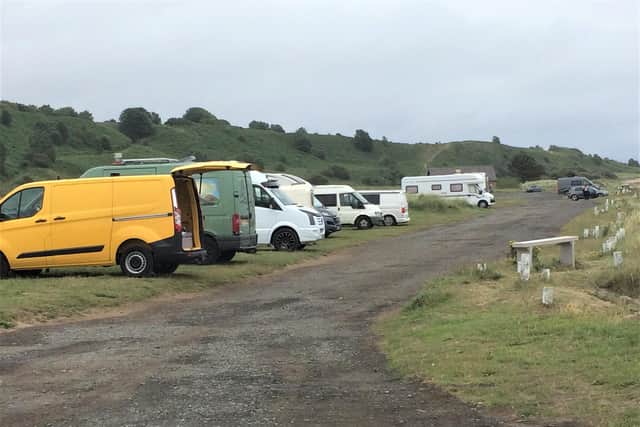 Camper vans parked at Alnmouth beach.