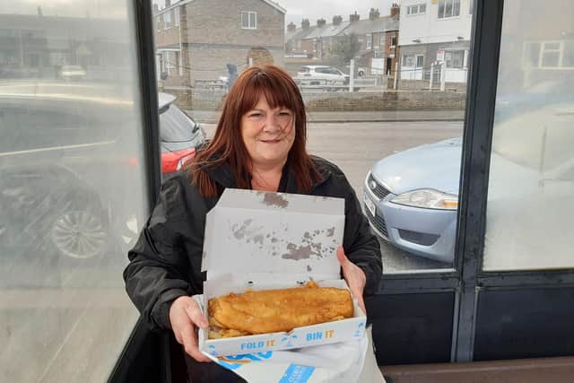 Lynn Keenan, 51, from North Shields, ready to enjoy her fish and chips with a view of the harbour after waiting in line.