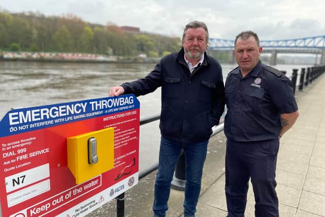Nick Pope and firefighter Tommy Richardson pictured next to one of the new emergency throw bag boards.