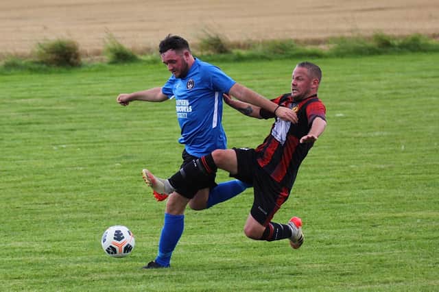 Action from Berwick Town's first official game in the North Northumberland League against Amble at Lowick on Saturday.