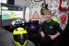 Teenager Will Crewdson with his professional racing simulator