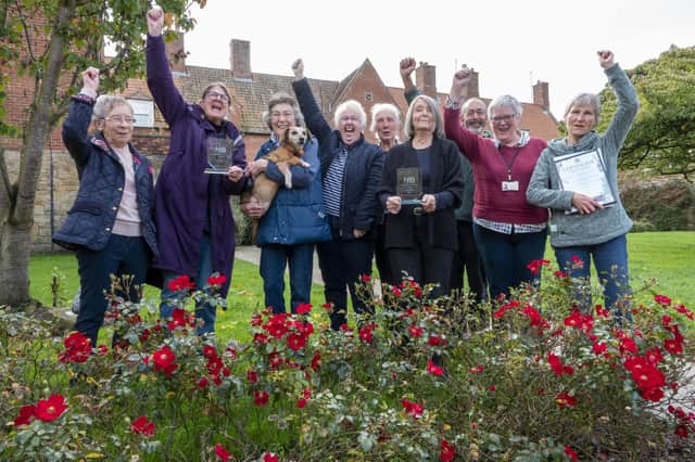 Alnwick in Bloom volunteers celebrate the town's success in last year's Northumbria in Bloom competition.
