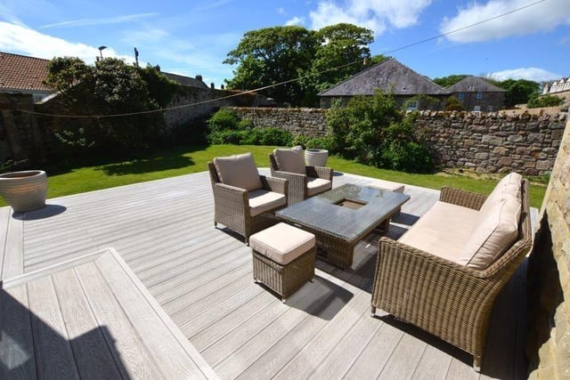 A large decking area in the south-facing garden.