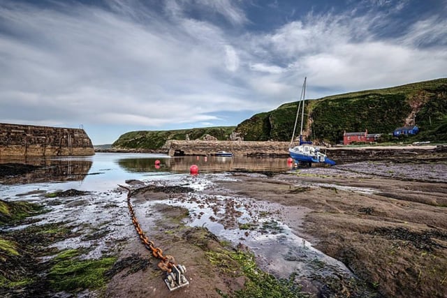 Dave Dixon's pretty picture of the harbour at Cove. It is accessed via a tunnel hewn into the cliff.