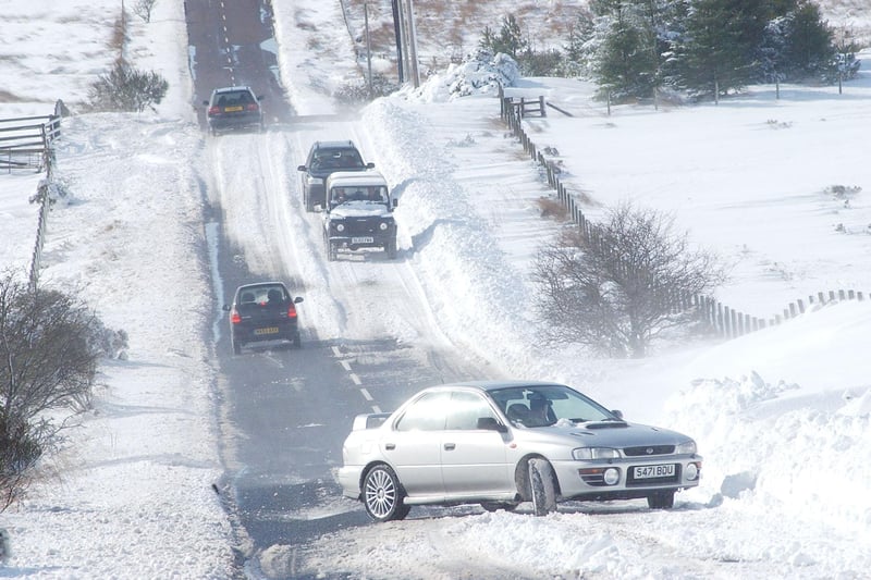 Cars getting stuck in the snow near Rothbury in March 2004.