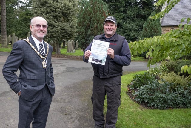 Mayor Geoff Watson and cemetery groundsman Ian Richardson with the Silver Gilt certificate.